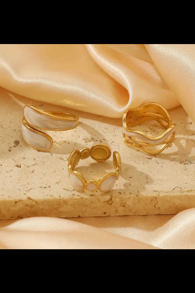Trio painted  white and gold rings