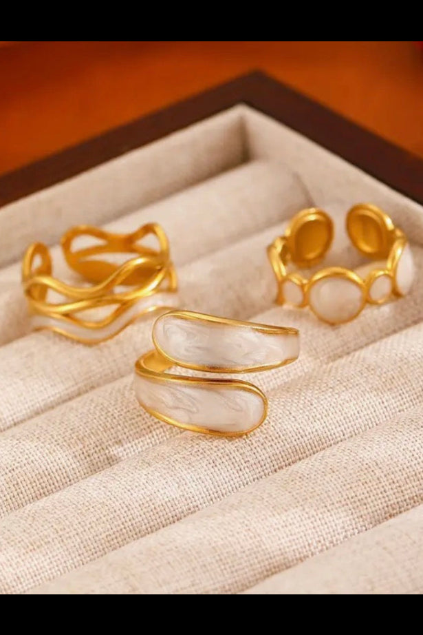 Trio painted  white and gold rings