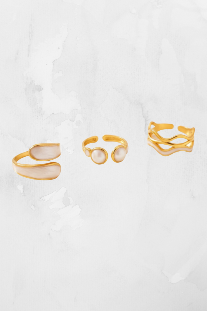 Trio painted  white and gold rings